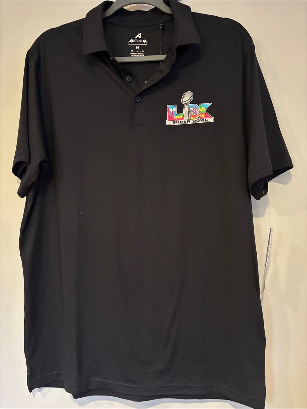 Antigua Black Polo with Colorful Super Bowl LIV Patch